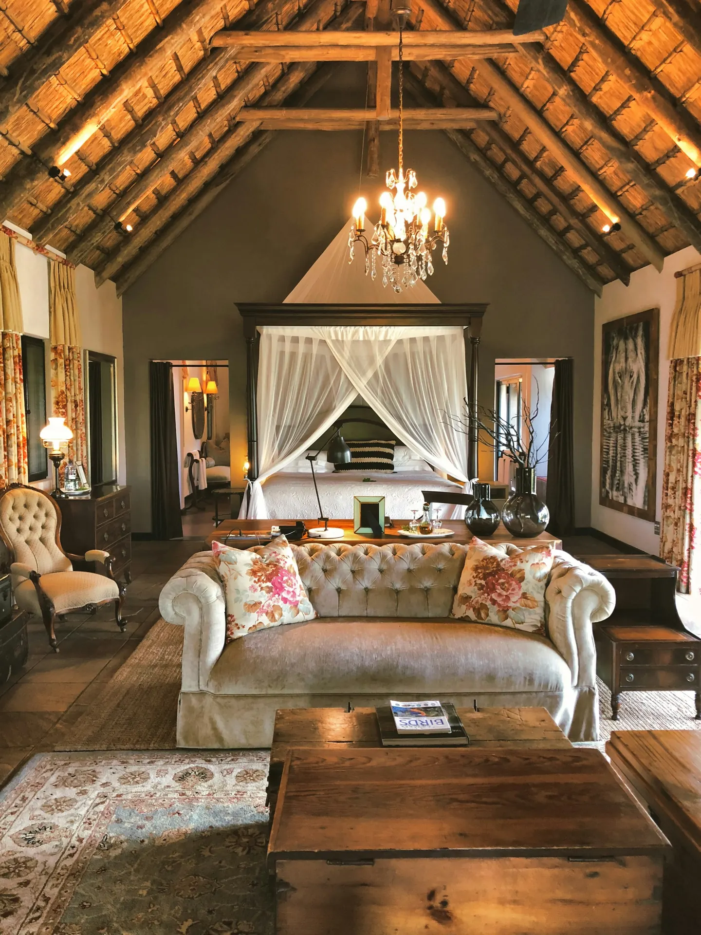 Lodge suite with a canopy bed and chandelier