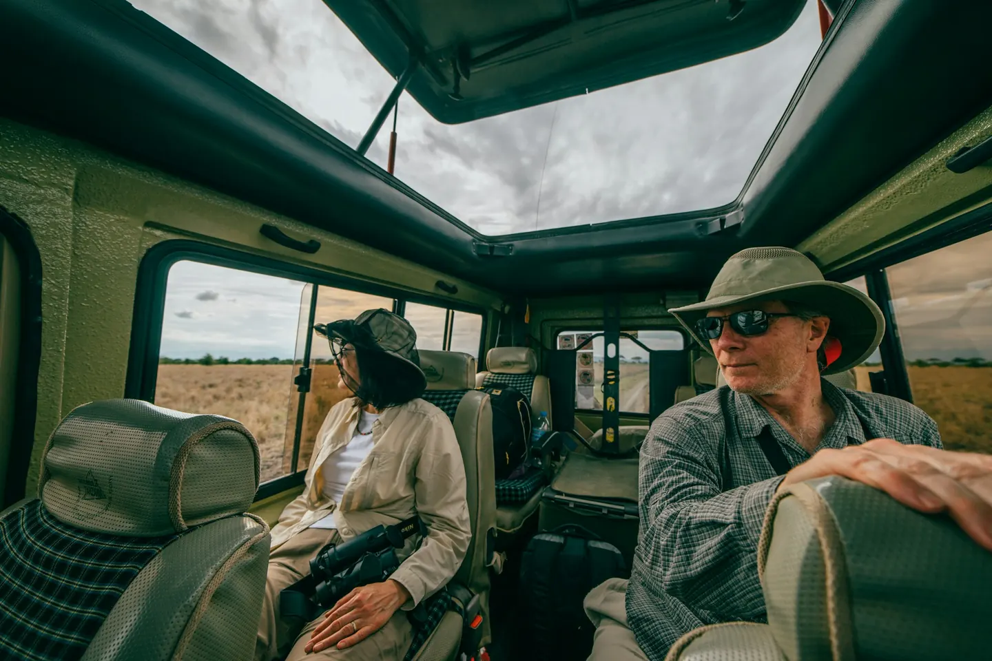 Couple on a game drive in an open vehicle