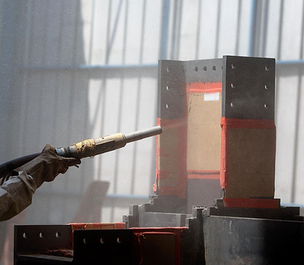 Steel getting sandblasted