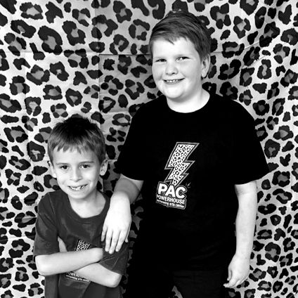 Boy Dancers from Powerhouse PAC Dance Studio smiling together.