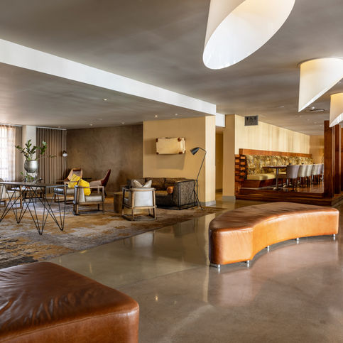 Interior photography of Southern Sun Garden Court Victoria Junction Hotel in Cape Town, featuring modern lounge seating, warm lighting, and stylish contemporary design