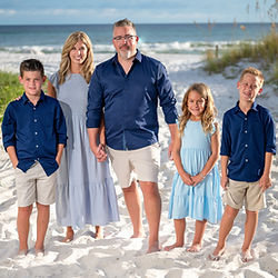 Family vacation photo shoot with the turquoise Gulf waters in the background