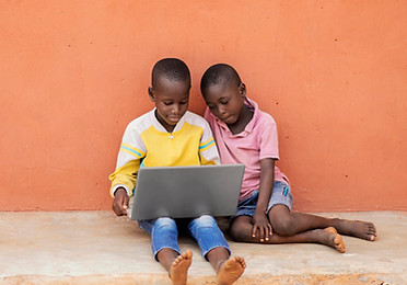 full-shot-african-kids-with-laptop.jpg