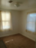 Comfortable main bedroom offering clean walls and a relaxing residential atmosphere.