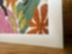 Thumbnail: Two black and white cats lounging among colourful plants and flowers in a retro-style textile artwork.