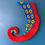 Thumbnail: Tufted red octopus tentacle wall hanging with blue underside and yellow suckers, made from acrylic wool, mounted with loops f