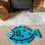 Thumbnail: Hand-tufted ‘Happy Plaice’ rug with vibrant red spots on turquoise, shaped like a playful fish.