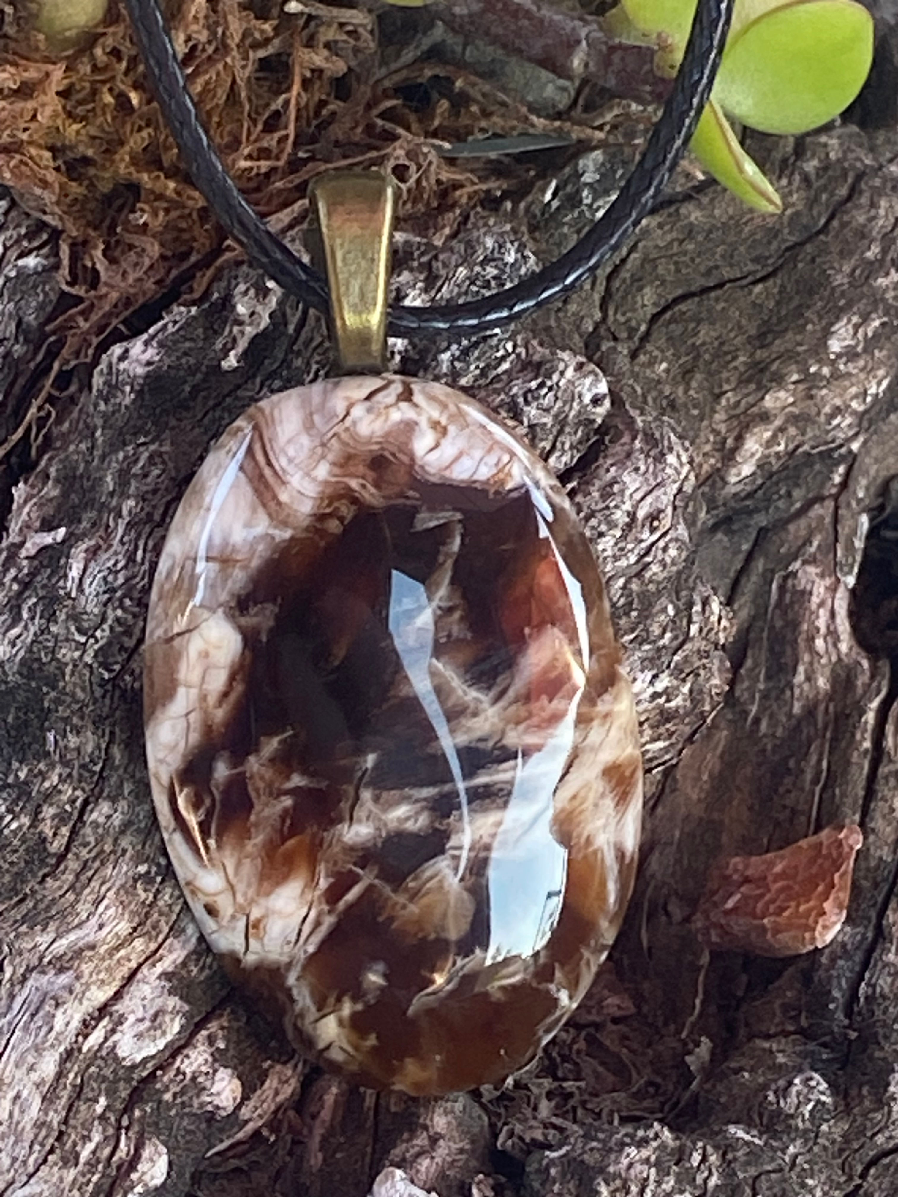 Close-up of Butte Creek Agate pendant showing intricate brown and cream patterns.