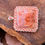 Thumbnail: Angled view of the Bubblegum Agate pendant with pink crystals encircling it.