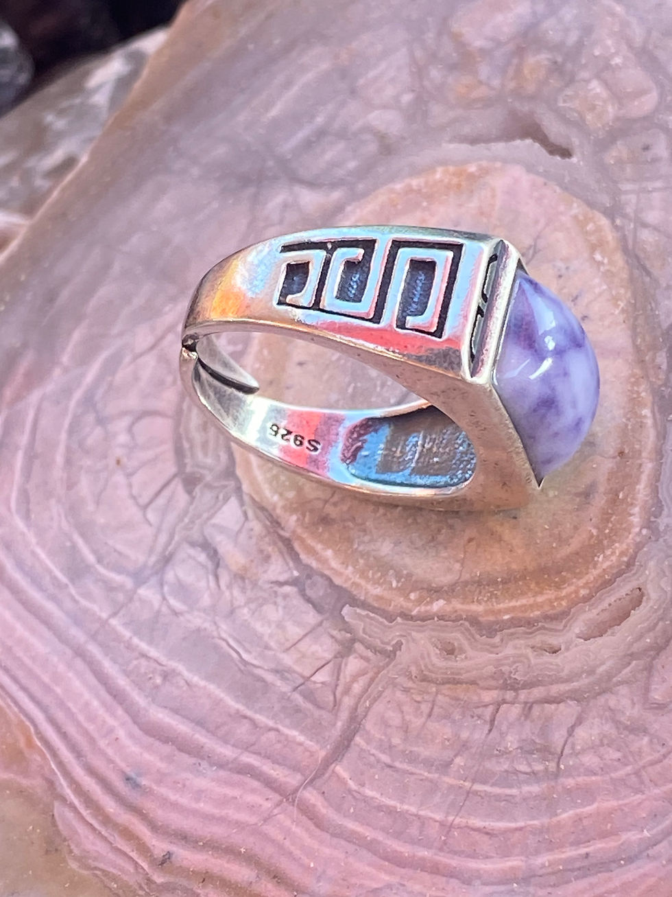 Thumbnail: Side profile of the Purple Opal Ring on a textured agate background, highlighting the sterling silver band with tribal etchin