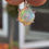 Thumbnail: Close-up view of a Welo opal pendant set in a sterling silver prong setting, with vibrant play-of-color.