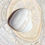 Thumbnail: Natural Banded Agate heart resting on a stone background, highlighting its unique textures.