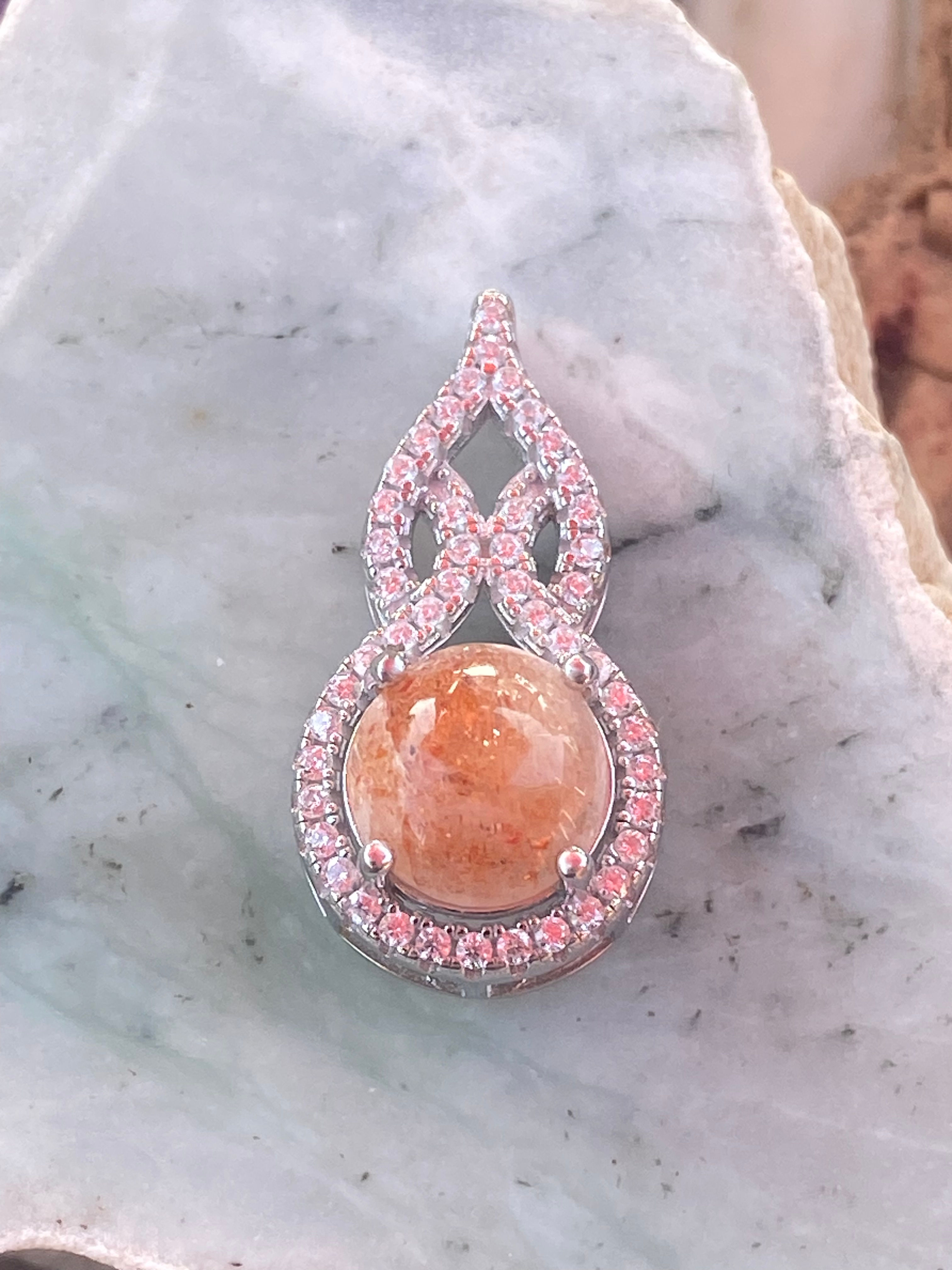 Oregon Sunstone pendant with crystal halo on silver-plated backing