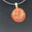 Thumbnail: Close-up of Fossilized Red Coral pendant showcasing its intricate patterns and natural beauty.