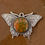 Thumbnail: Unakite gemstone set in a silver butterfly-shaped pendant with intricate detailing.