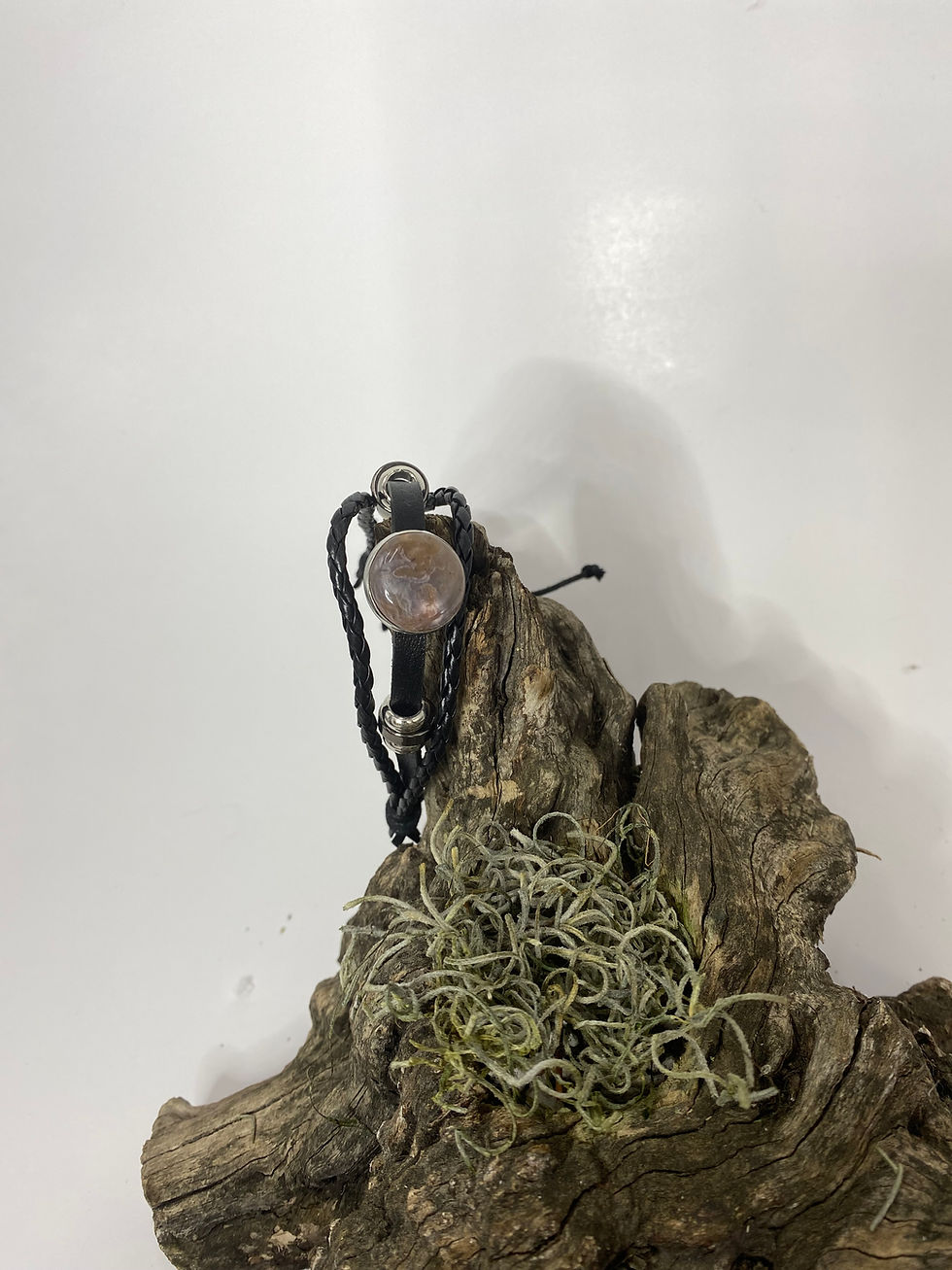 Thumbnail: Full view of Butte Creek Agate black leather bracelet resting on moss-covered driftwood.