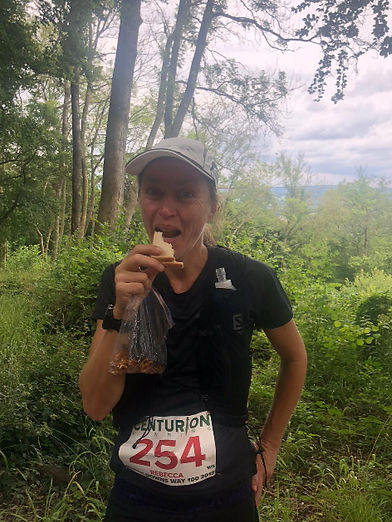Rebecca Palser ultramarathon running on the trail, fuelled by evidence-based nutrition
