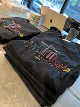Scribe Summit T-shirts featured a rainbow outline of Seattle.