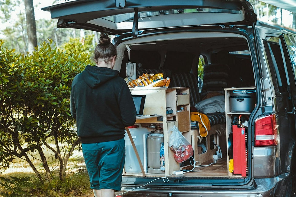 A small campervan with rear opened