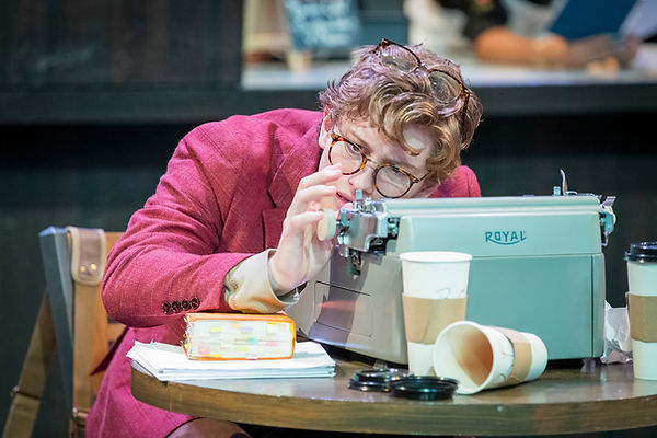 Brian Davis actor sitting at typewriter
