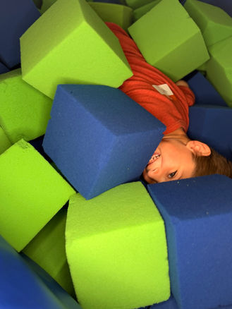 Kids playing in the foam pit at Jump Air Zone