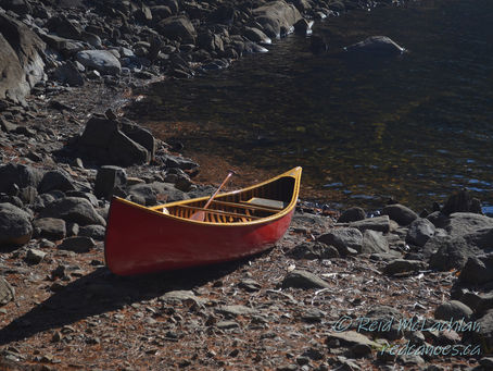 #12 Paddling Pic: Of Wooden Canoes
