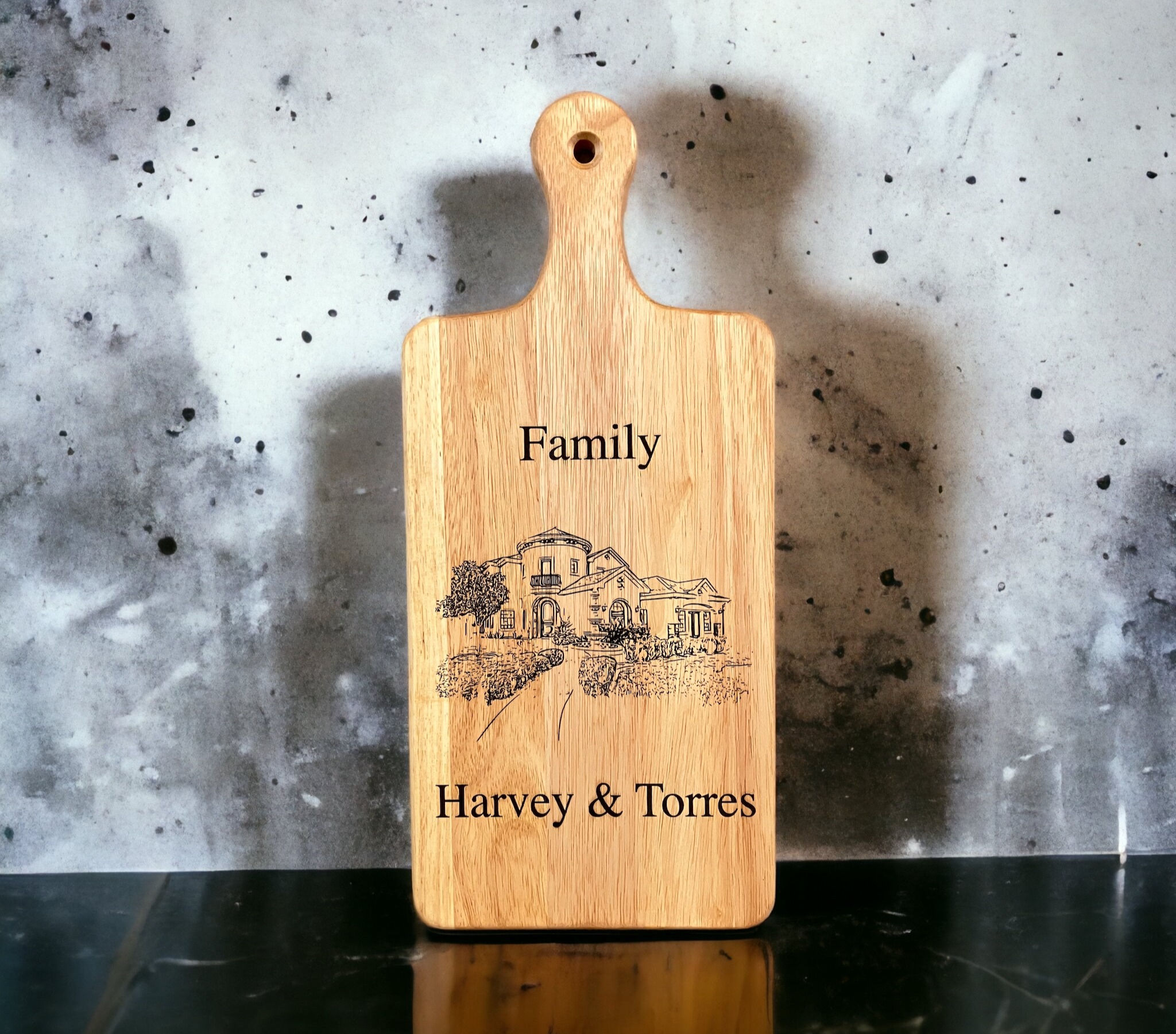 laser engraved portrait of home on charcuterie board