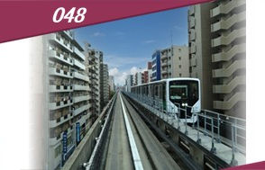The Nippori-Toneri Liner running at the height of a 6th-floor building