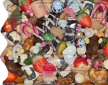 A selection of sweets and fruits packed into a dipping platter