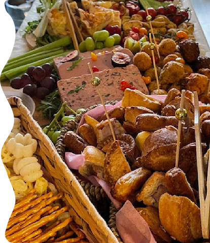 A colourful, tasty looking graze table by Perfect Platters by Julie is set up in a rustic, appealling fashion