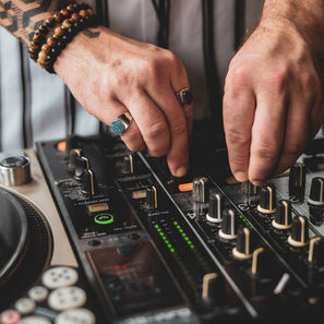 Photo of hands controlling an audio board