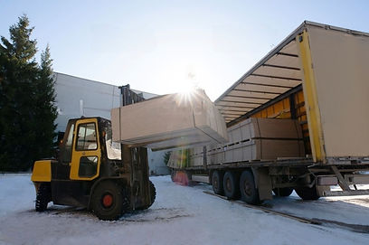 Truck getting loading with high volume shipment with forklift. Pallets crates boxes.jpeg