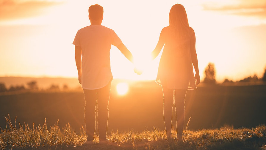 couple holding hands sunset.jpeg