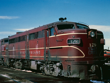 a Rock Island Line traincar against blue sky