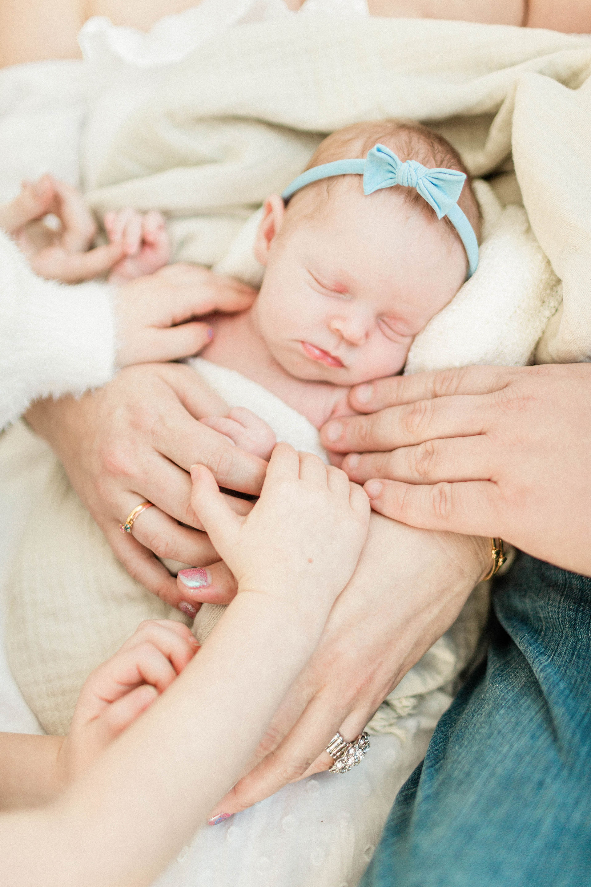 parents holding baby
