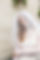 Bride wearing a vintage Vera Wang wedding dress with long sleeves and short veil
