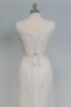 Thumbnail: Top half back view of vintage corset wedding dress