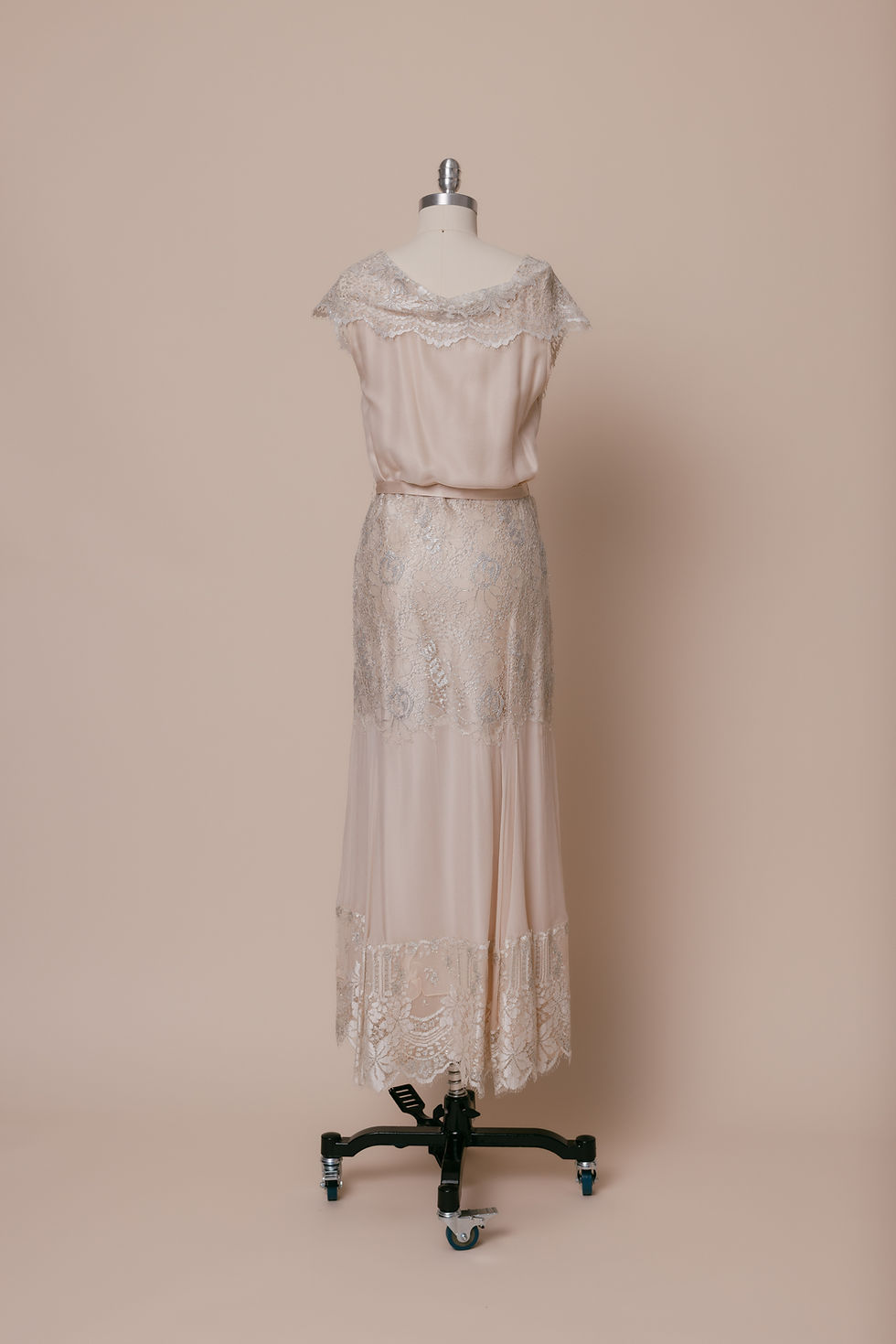 Vintage pink silk and French lace Art Deco inspired slip dress on dress form against ivory backdrop