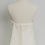 Thumbnail: Back detail of vintage Vera Wang wedding dress on dress form in Atlanta bridal boutique