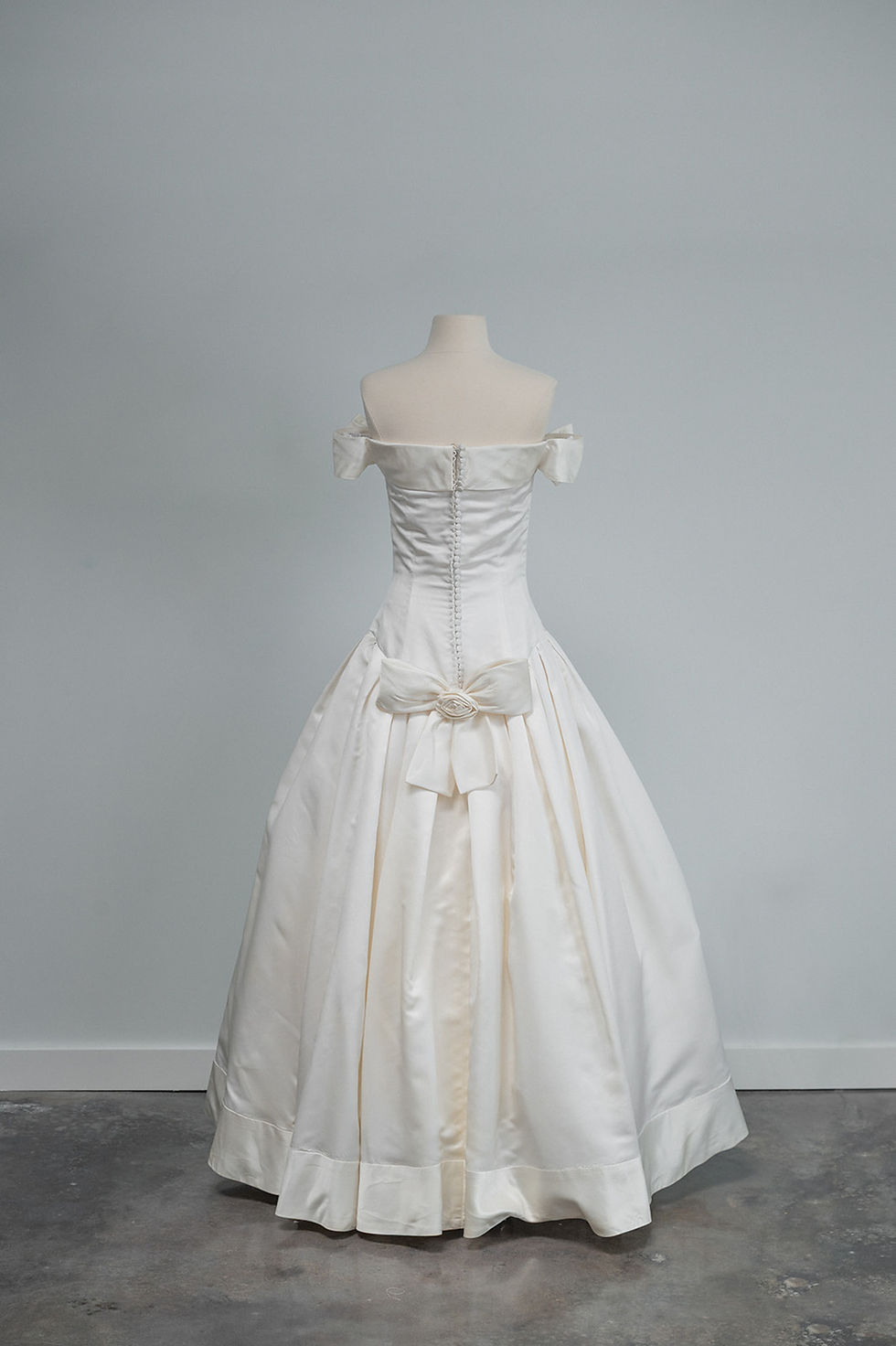 Thumbnail: Full back view of 1994 Vera Wang wedding dress shown in Estee Lauder Beautiful ads