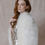 Thumbnail: Red haired model wearing vintage Oscar de la Renta bridal mini dress against beige backdrop