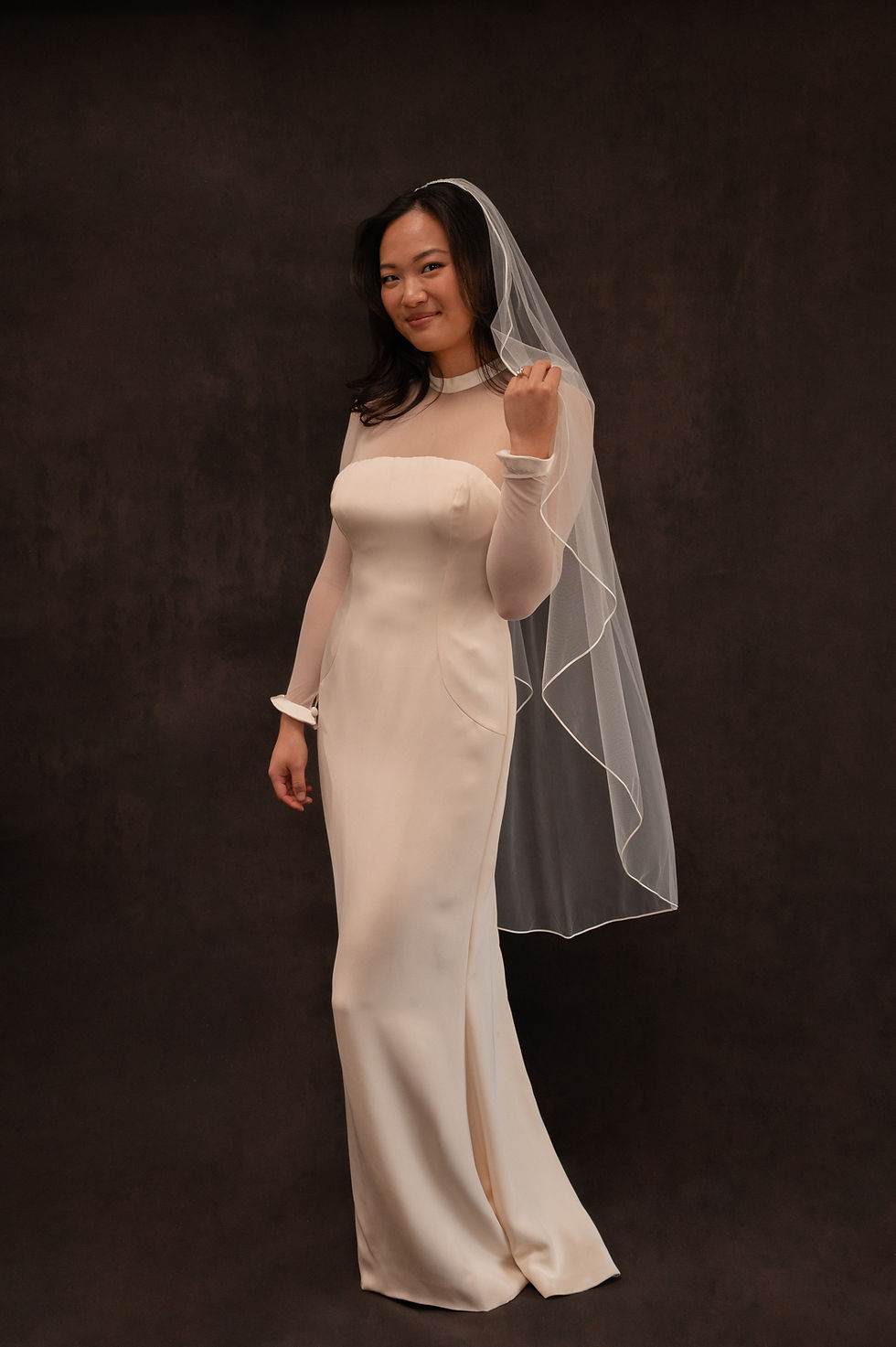 Thumbnail: Model wearing vintage Vera Wang Parent Trap wedding dress in Atlanta bridal shop