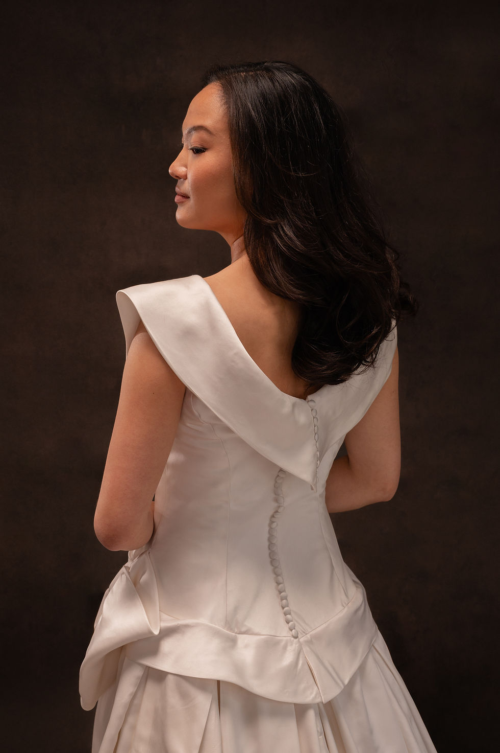 Thumbnail: Model showing back view of vintage Dior wedding dress