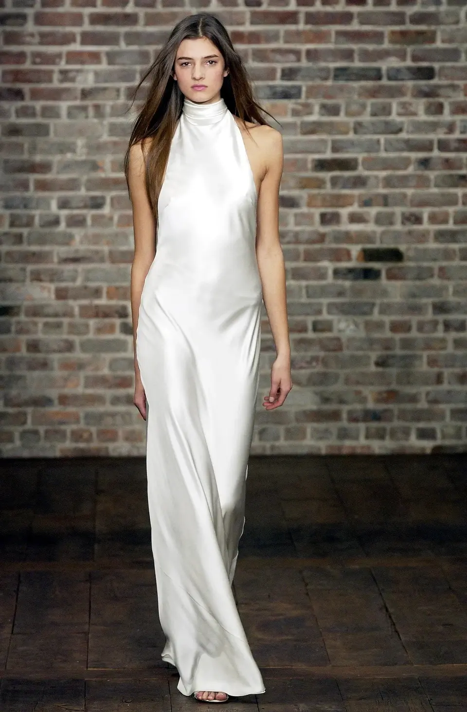 Thumbnail: Model walks the runway at the Ralph Lauren autumn winter 2003 show in a halter wedding dress
