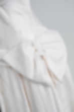 Thumbnail: Close up of oversized bow on vintage Christian Dior wedding dress