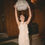 Thumbnail: Bride wearing vintage Oscar de la Renta mini dress while laughing and holding a lampshade