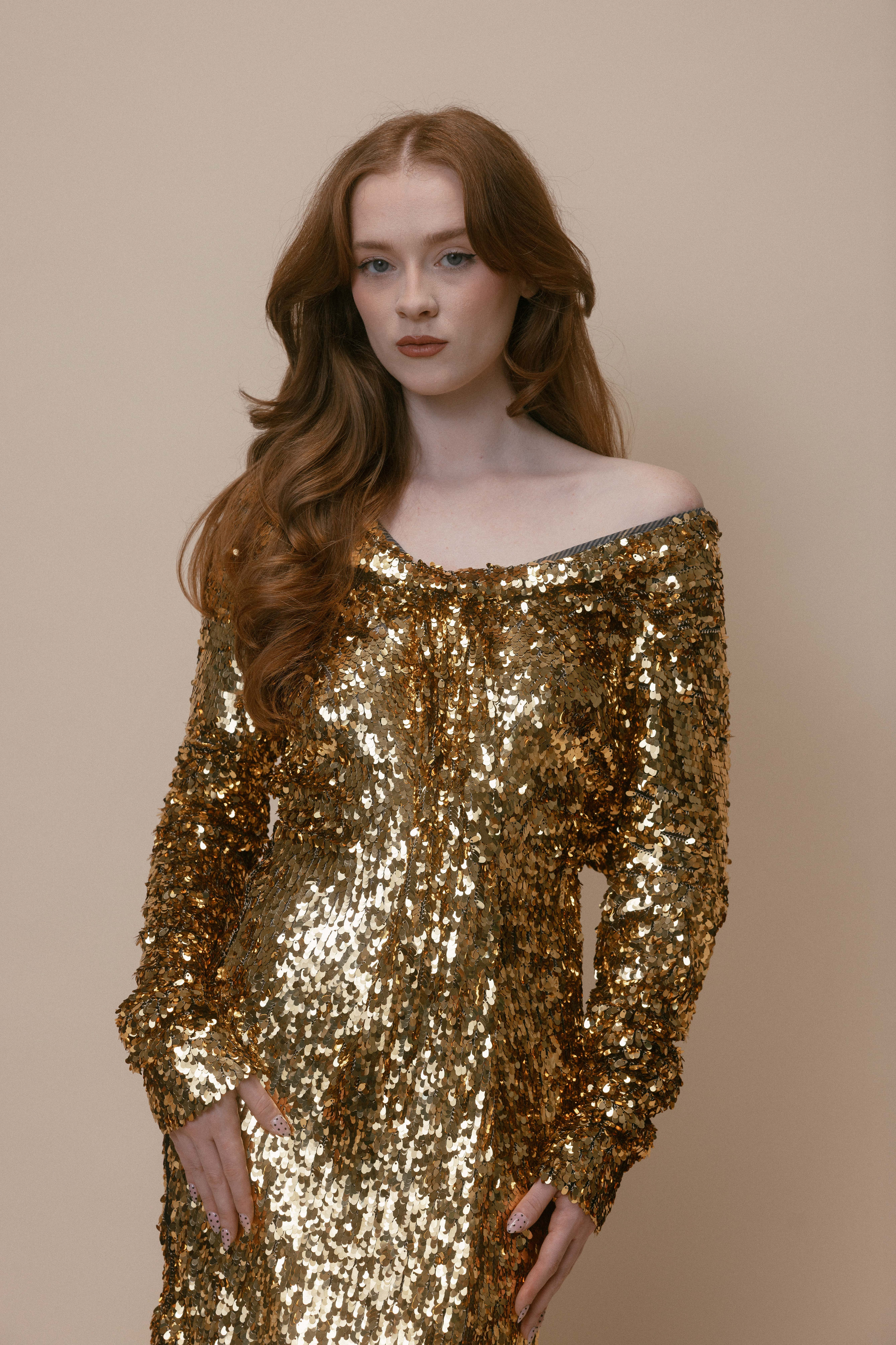 Model wearing archival Vivienne Westwood gold label dress covered in gold sequins