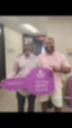 Daniel Foreman celebrating with a client after a successful real estate closing