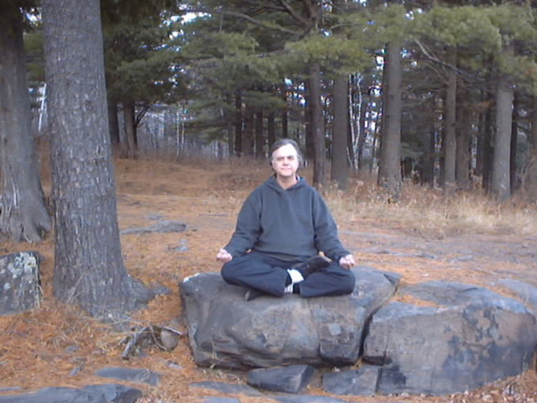 Al sitting on a rock.jpg