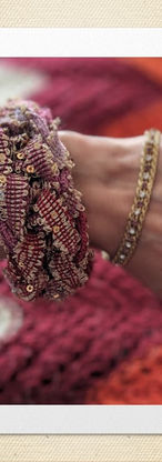 thick variegated pink and gold knitted bracelet